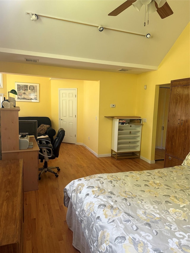 12 Rosell Ct, Lagrangeville, NY 12540 - bedroom featuring wood finished floors, vaulted ceiling, an office area, baseboards, and a ceiling fan