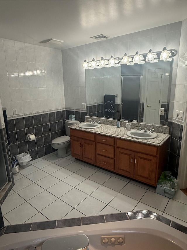 12 Rosell Ct, Lagrangeville, NY 12540 - bathroom featuring tile walls, double vanity, tile patterned floors, and toilet