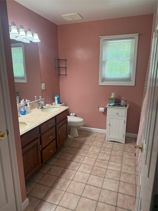 12 Rosell Ct, Lagrangeville, NY 12540 - bathroom featuring plenty of natural light, double vanity, tile patterned floors, and toilet