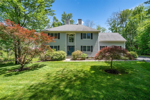 10 Wyche Way, Ossining, NY 10562 - colonial-style house featuring a chimney and a front lawn
