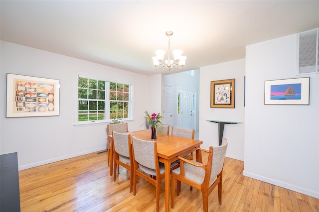 10 Wyche Way, Ossining, NY 10562 - dining space with a chandelier, light wood-style flooring, and baseboards