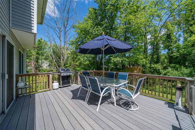 10 Wyche Way, Ossining, NY 10562 - wooden terrace featuring outdoor dining area, a grill, and view of scattered trees