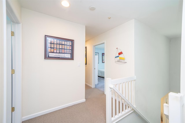 10 Wyche Way, Ossining, NY 10562 - hallway featuring an upstairs landing, light carpet, baseboards, and recessed lighting