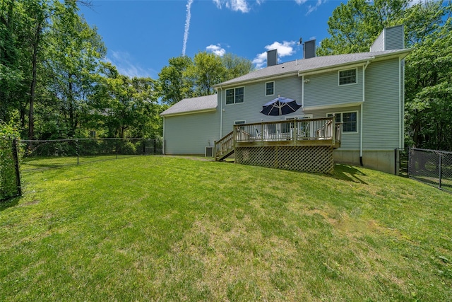 10 Wyche Way, Ossining, NY 10562 - rear view of house featuring a chimney, a wooden deck, and stairs