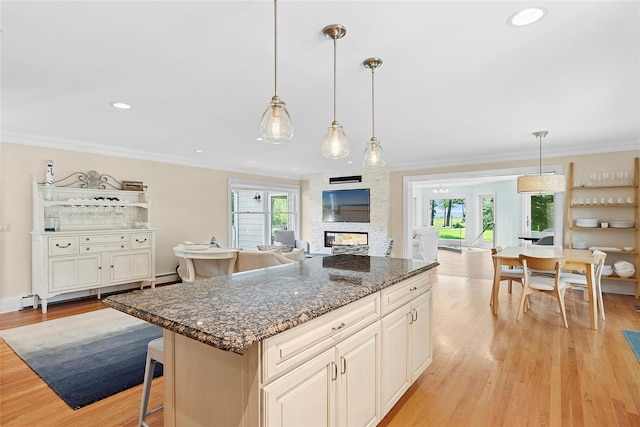 2360 Marlene Ln, Mattituck, NY 11952 - kitchen featuring open floor plan, light wood-style flooring, healthy amount of natural light, ornamental molding, and recessed lighting