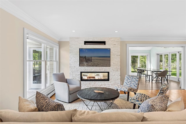 2360 Marlene Ln, Mattituck, NY 11952 - living room with ornamental molding, wood finished floors, and a stone fireplace