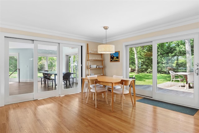 2360 Marlene Ln, Mattituck, NY 11952 - dining area featuring crown molding and light wood-style flooring