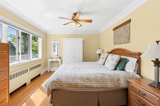 2360 Marlene Ln, Mattituck, NY 11952 - bedroom with radiator heating unit, ornamental molding, light wood finished floors, and a ceiling fan