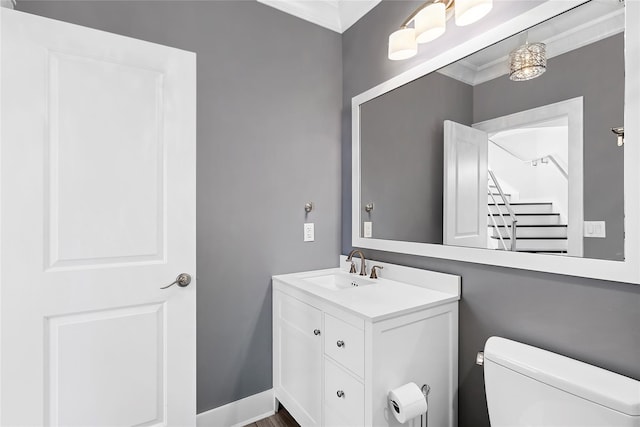 2360 Marlene Ln, Mattituck, NY 11952 - half bath featuring vanity, toilet, and crown molding