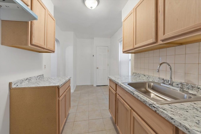 1856 Edison Ave, Bronx, NY 10461 - kitchen with a sink, under cabinet range hood, light brown cabinetry, and light countertops