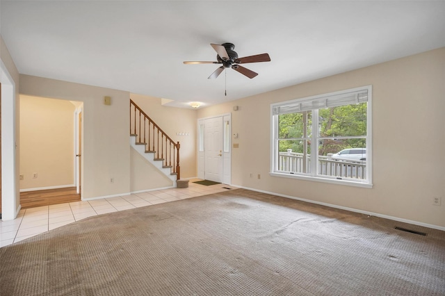 7 Mailler Ave, Cornwall, NY 12518 - unfurnished living room featuring light tile patterned flooring, stairway, a ceiling fan, and baseboards