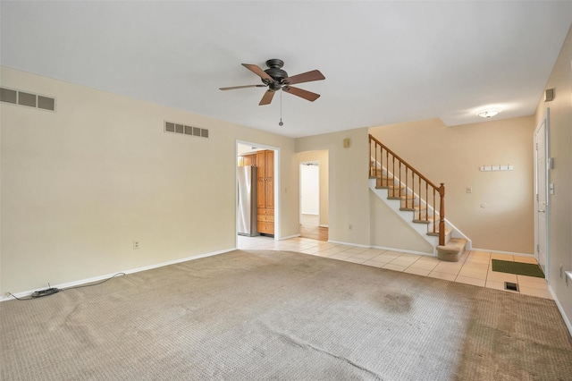 7 Mailler Ave, Cornwall, NY 12518 - unfurnished living room with ceiling fan, tile patterned flooring, stairway, carpet flooring, and baseboards