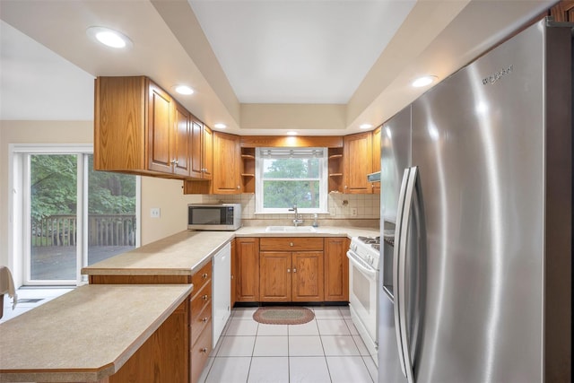 7 Mailler Ave, Cornwall, NY 12518 - kitchen featuring appliances with stainless steel finishes, open shelves, a sink, decorative backsplash, and light countertops