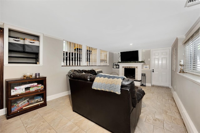 651 Hyman Ave, Bay Shore, NY 11706 - living room with baseboards, a fireplace, and recessed lighting