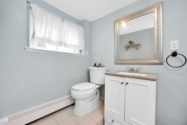 651 Hyman Ave, Bay Shore, NY 11706 - bathroom with a baseboard radiator, vanity, toilet, tile patterned floors, and baseboards