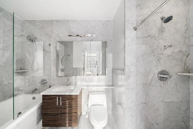 11-24 31st Ave Unit 5E, Astoria, NY 11106 - bathroom featuring tile walls, tiled shower / bath, vanity, and toilet