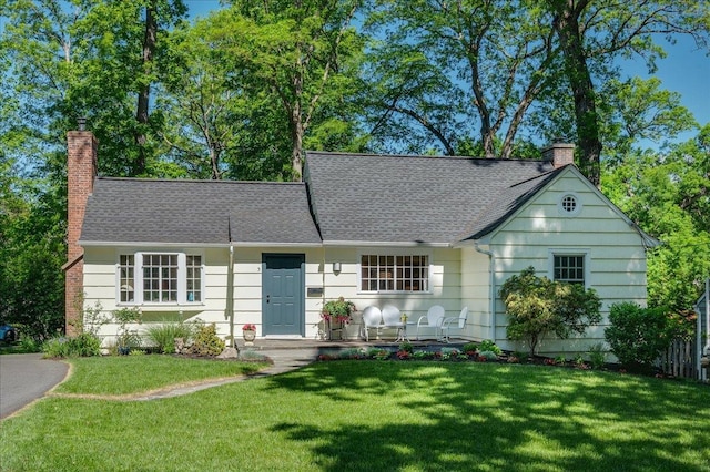 3 Reigate Pl, Suffern, NY 10901 - view of front of property featuring a chimney, a front lawn, and a shingled roof