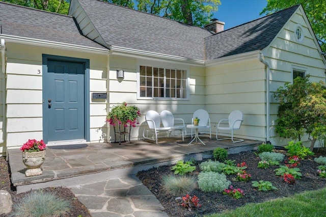 3 Reigate Pl, Suffern, NY 10901 - entrance to property featuring a shingled roof and a chimney