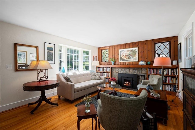 3 Reigate Pl, Suffern, NY 10901 - living area featuring a fireplace, light wood-style flooring, and baseboards