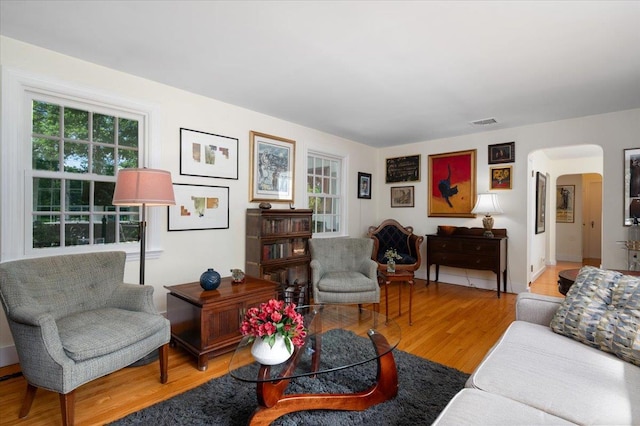 3 Reigate Pl, Suffern, NY 10901 - living room with arched walkways, healthy amount of natural light, and wood finished floors