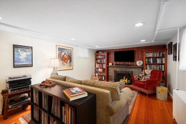 3 Reigate Pl, Suffern, NY 10901 - living area with radiator, recessed lighting, a fireplace, and light wood-style floors
