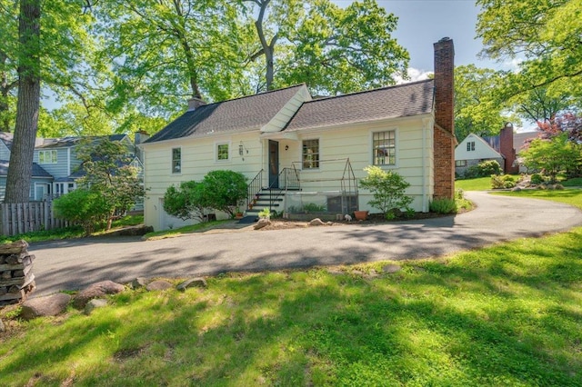 3 Reigate Pl, Suffern, NY 10901 - view of front of home featuring a chimney and driveway