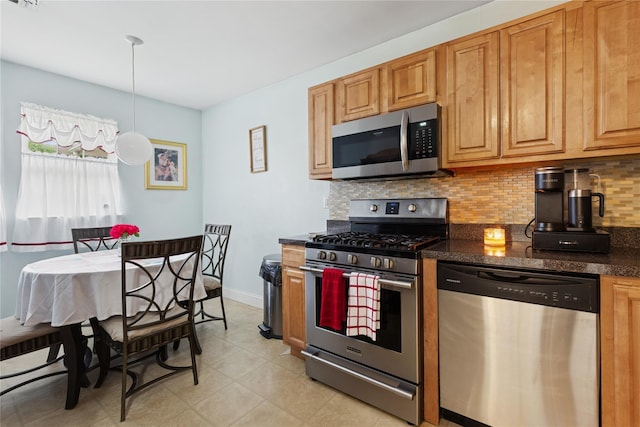 32 Blueberry Cmn, Riverhead, NY 11901 - kitchen with appliances with stainless steel finishes, decorative backsplash, and decorative light fixtures