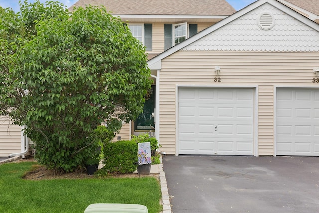 32 Blueberry Cmn, Riverhead, NY 11901 - garage with asphalt driveway