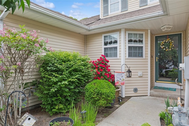 32 Blueberry Cmn, Riverhead, NY 11901 - view of exterior entry with roof with shingles