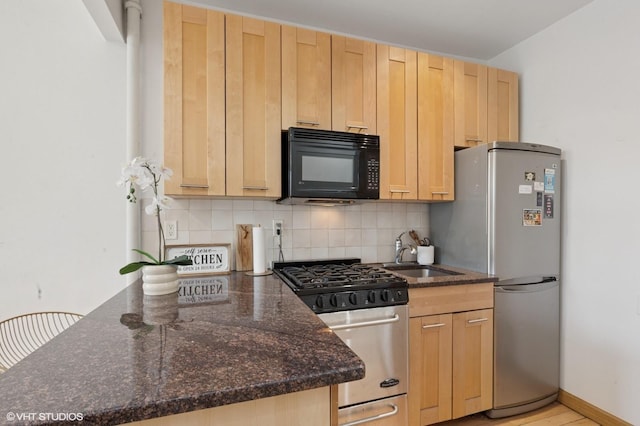 621 E 6th St # 7, New York Manhattan, NY 10009 - kitchen featuring black microwave, range with gas cooktop, a sink, freestanding refrigerator, and light brown cabinetry