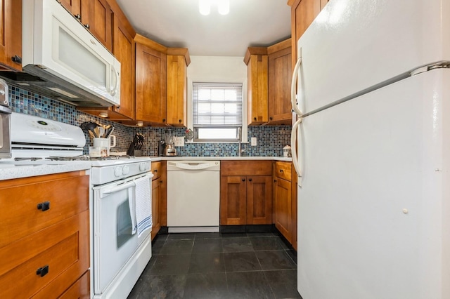 240 Mariners Way, Copiague, NY 11726 - kitchen with white appliances, light countertops, decorative backsplash, and brown cabinets