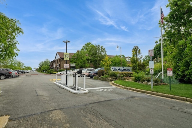 240 Mariners Way, Copiague, NY 11726 - view of asphalt road with traffic signs, curbs, and street lighting