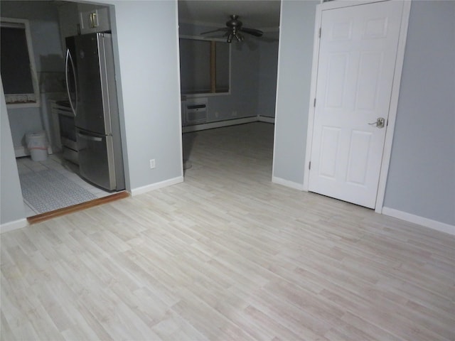 2453A Union Blvd Unit 21A, Islip, NY 11751 - spare room featuring a ceiling fan, light wood-style floors, and baseboards