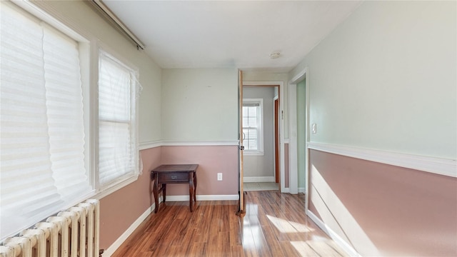 105 Pilgrim Pl, Valley Stream, NY 11580 - unfurnished room featuring radiator, wood finished floors, baseboards, and a smoke detector