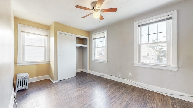 105 Pilgrim Pl, Valley Stream, NY 11580 - unfurnished bedroom with wood finished floors, baseboards, a closet, radiator heating unit, and ceiling fan