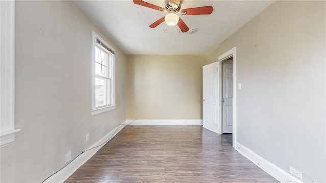 105 Pilgrim Pl, Valley Stream, NY 11580 - empty room with wood finished floors, ceiling fan, and baseboards