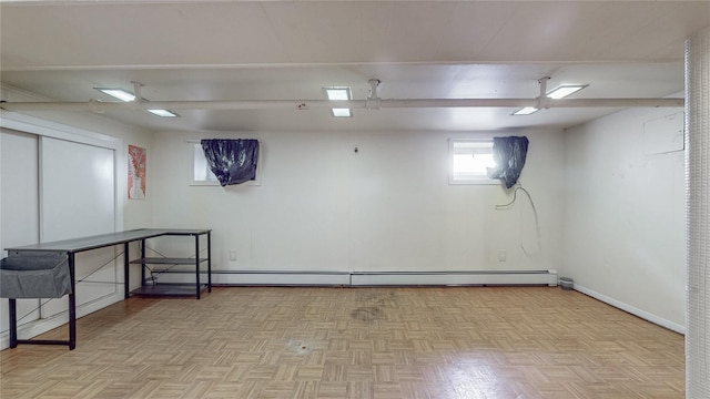 105 Pilgrim Pl, Valley Stream, NY 11580 - basement featuring baseboard heating and baseboards