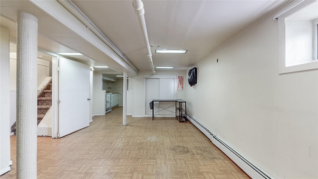 105 Pilgrim Pl, Valley Stream, NY 11580 - below grade area featuring a baseboard heating unit and stairs