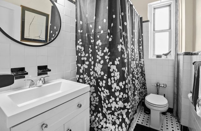 1 Bronxville Rd Unit 6M, Bronxville, NY 10708 - bathroom featuring tile walls, vanity, toilet, and tile patterned flooring
