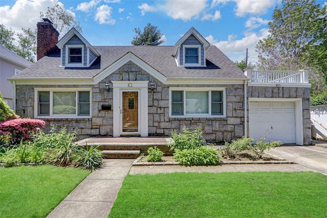 61 Maple Dr, New Hyde Park, NY 11040 - view of front facade with stone siding, a garage, a front yard, a chimney, and roof with shingles