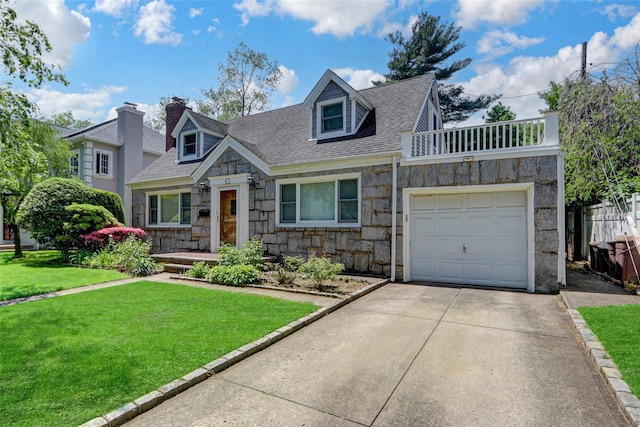61 Maple Dr, New Hyde Park, NY 11040 - cape cod house featuring stone siding, a shingled roof, a front yard, driveway, and a chimney