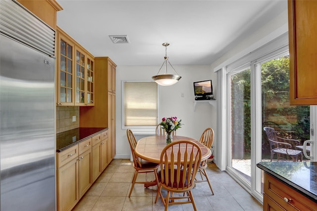 61 Maple Dr, New Hyde Park, NY 11040 - dining area with light tile patterned floors