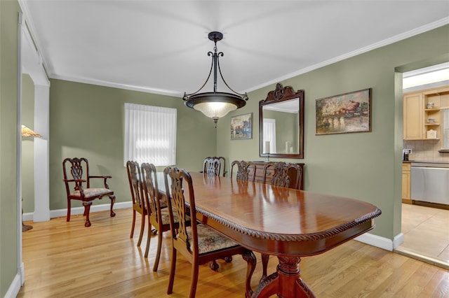 61 Maple Dr, New Hyde Park, NY 11040 - dining area with light wood finished floors, ornamental molding, and baseboards