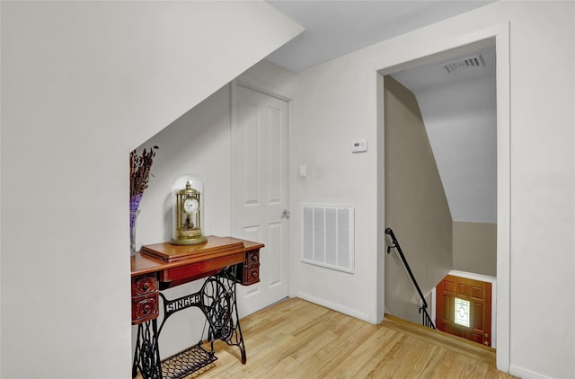 61 Maple Dr, New Hyde Park, NY 11040 - corridor featuring an upstairs landing, wood finished floors, and baseboards