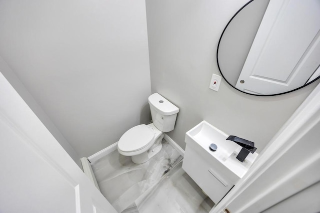 63 Ridgeway Ave, Setauket, NY 11733 - bathroom with toilet, marble finish flooring, vanity, and baseboards