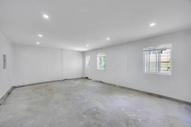 63 Ridgeway Ave, Setauket, NY 11733 - spare room featuring unfinished concrete flooring, recessed lighting, and baseboards