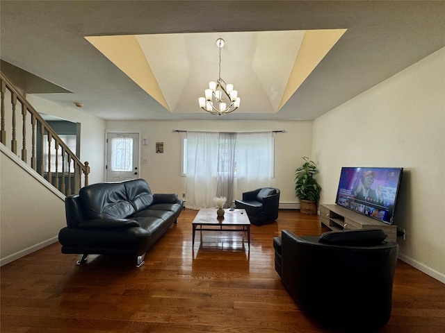 146 Grand Blvd, Brentwood, NY 11717 - living area with a chandelier, a baseboard heating unit, wood finished floors, stairway, and baseboards