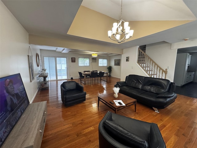 146 Grand Blvd, Brentwood, NY 11717 - living room with a chandelier, wood finished floors, stairs, and vaulted ceiling