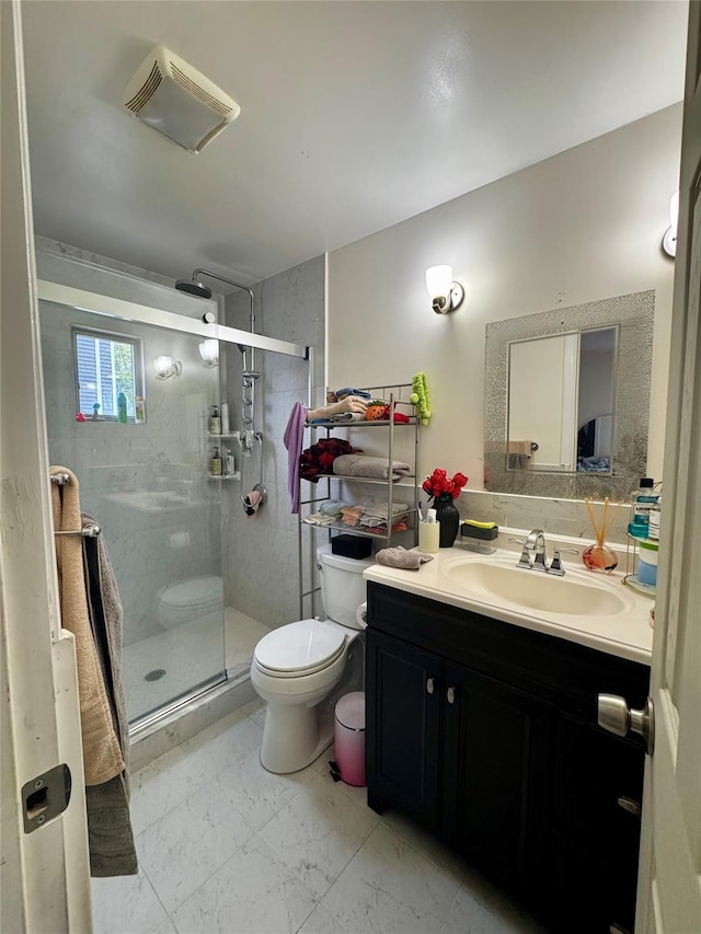 146 Grand Blvd, Brentwood, NY 11717 - bathroom with toilet, vanity, a shower stall, and marble finish flooring