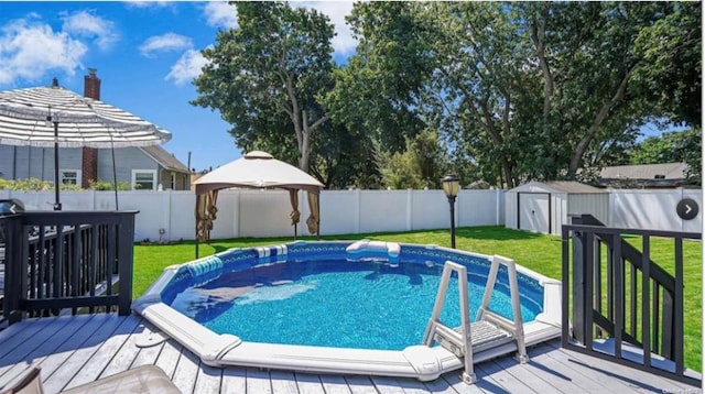 146 Grand Blvd, Brentwood, NY 11717 - view of pool with a wooden deck and a gazebo